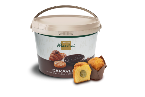 Velika kanta namaza Master Martini Caravel pored prerezanog punjenog muffina i cijelog muffina.